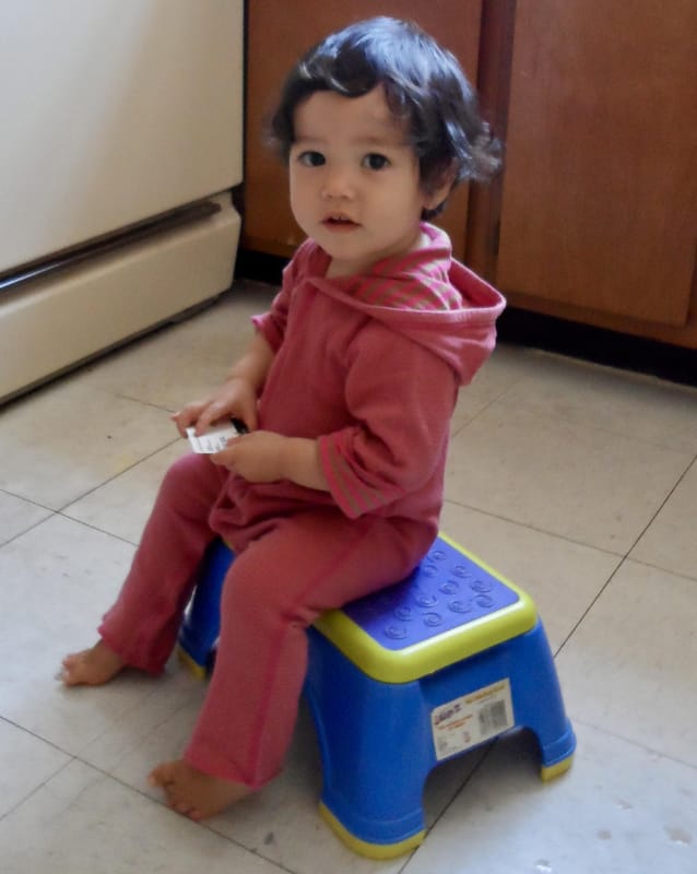 toddler on a stool